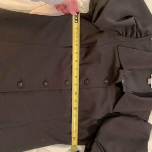 Calvin Klein black sheath dress in size 6, short sleeves, with cloth button.